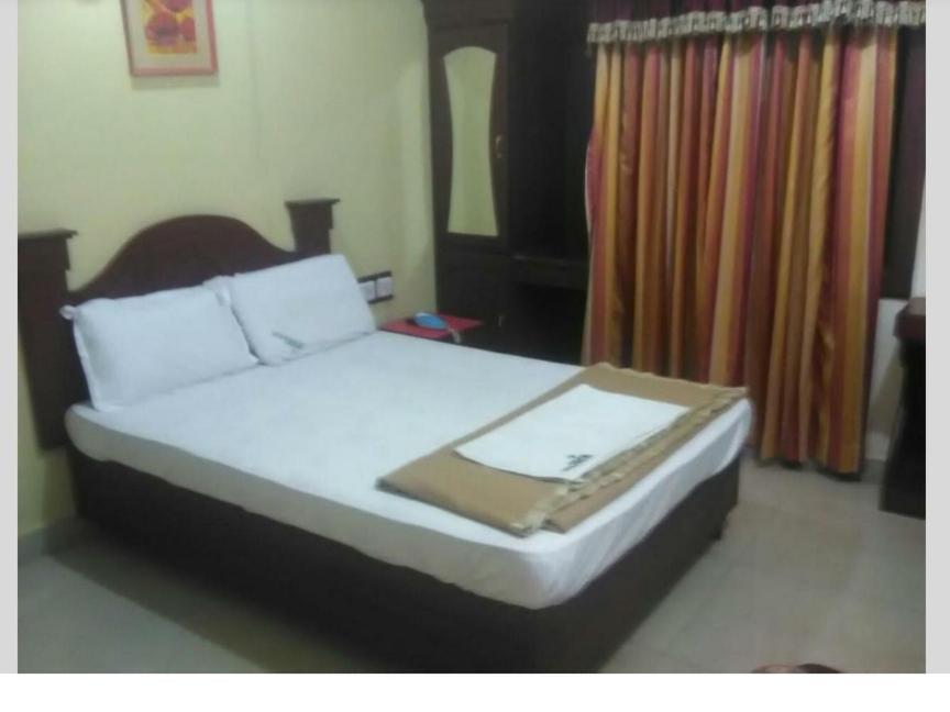 Hotel Priya Chengannur Pokoj fotografie