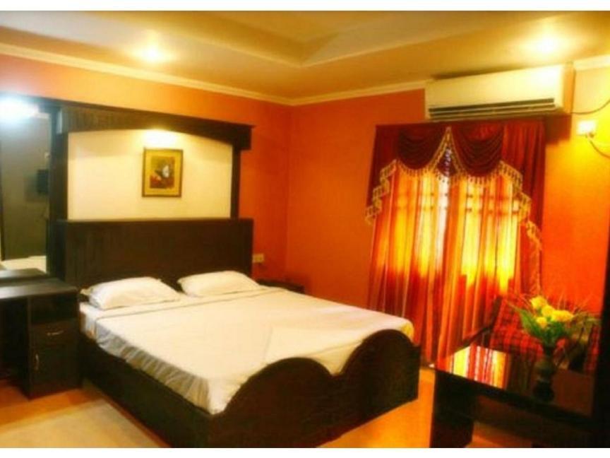 Hotel Priya Chengannur Pokoj fotografie